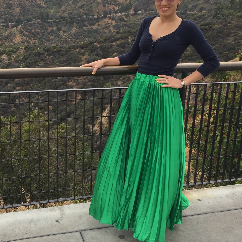 Green pleated satin maxi skirt